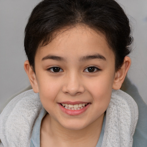 Joyful white child female with short  brown hair and brown eyes