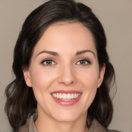 Joyful white young-adult female with medium  brown hair and brown eyes