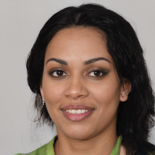 Joyful latino young-adult female with medium  black hair and brown eyes