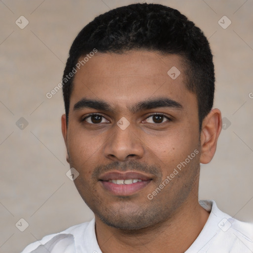 Joyful latino young-adult male with short  black hair and brown eyes