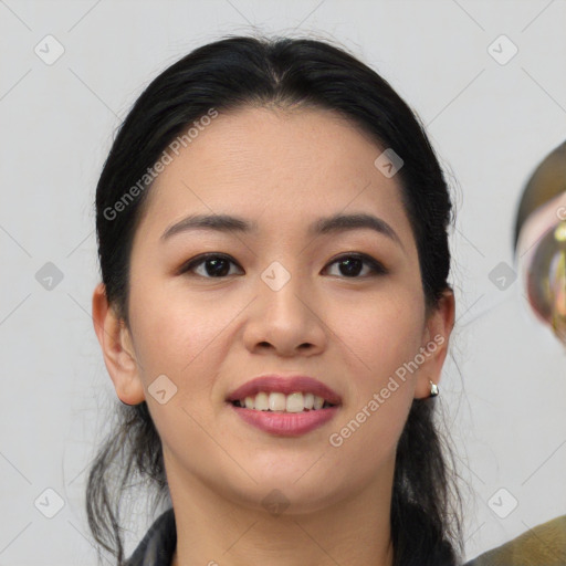 Joyful asian young-adult female with medium  black hair and brown eyes