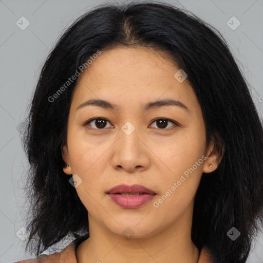 Joyful asian young-adult female with medium  black hair and brown eyes