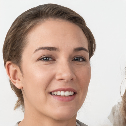 Joyful white young-adult female with medium  brown hair and brown eyes