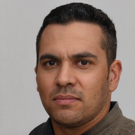 Neutral white adult male with short  black hair and brown eyes