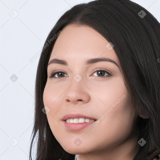 Joyful white young-adult female with long  black hair and brown eyes