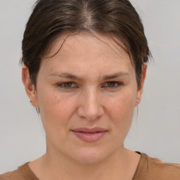 Joyful white adult female with short  brown hair and brown eyes