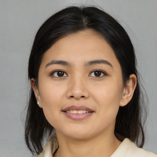 Joyful asian young-adult female with medium  brown hair and brown eyes