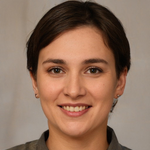 Joyful white young-adult female with medium  brown hair and brown eyes