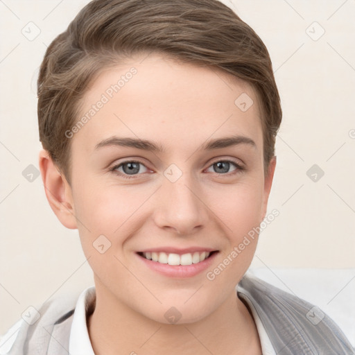 Joyful white young-adult female with short  brown hair and grey eyes