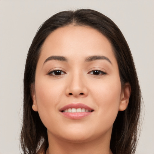 Joyful white young-adult female with long  brown hair and brown eyes