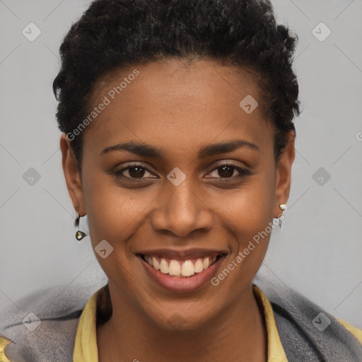 Joyful black young-adult female with short  brown hair and brown eyes