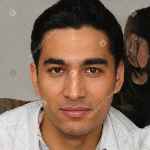 Joyful latino young-adult male with short  brown hair and brown eyes