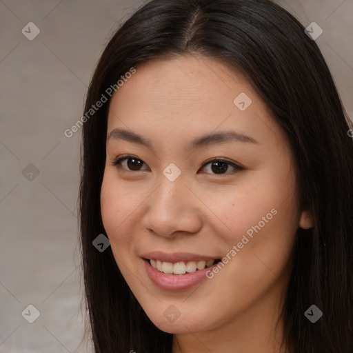 Joyful asian young-adult female with long  brown hair and brown eyes