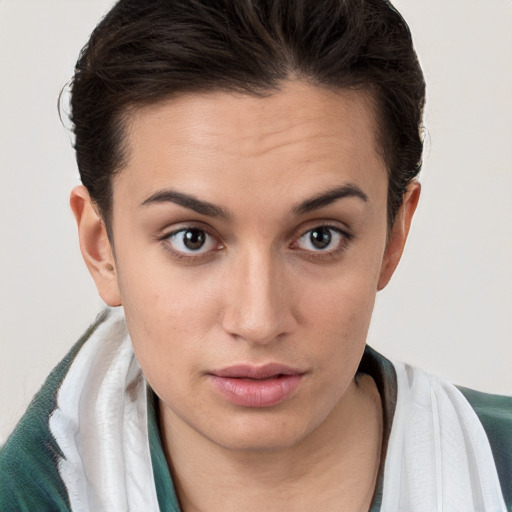 Neutral white young-adult female with short  brown hair and brown eyes