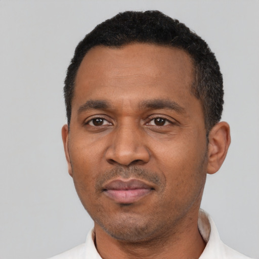 Neutral latino adult male with short  black hair and brown eyes