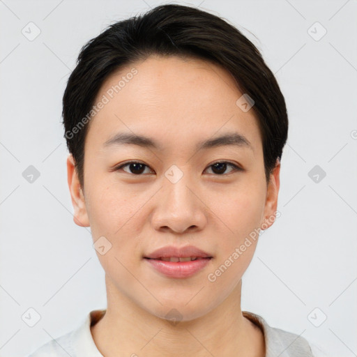 Joyful asian young-adult female with short  brown hair and brown eyes