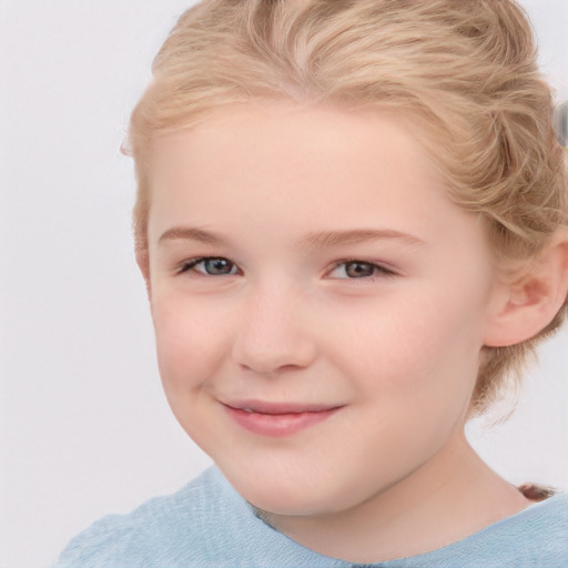 Joyful white child female with short  brown hair and blue eyes