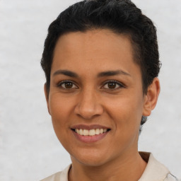 Joyful latino young-adult female with short  brown hair and brown eyes