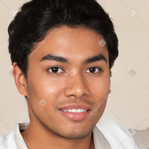 Joyful latino young-adult male with short  brown hair and brown eyes