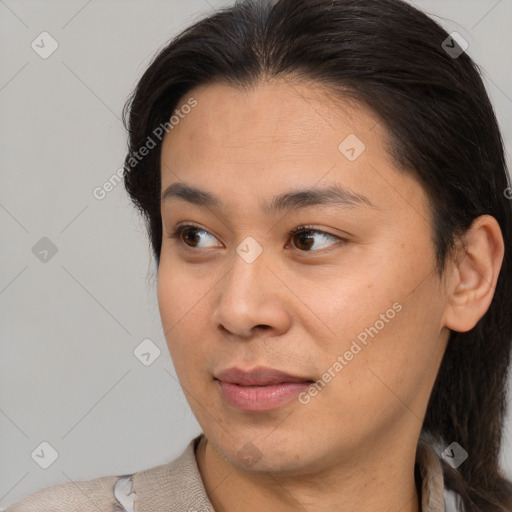 Joyful white young-adult female with medium  brown hair and brown eyes