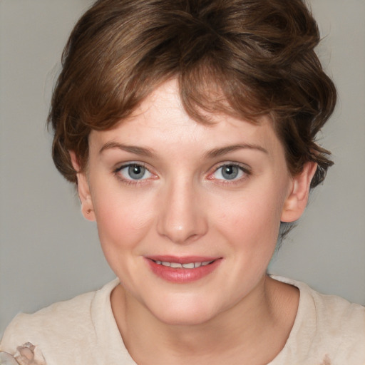 Joyful white young-adult female with medium  brown hair and blue eyes