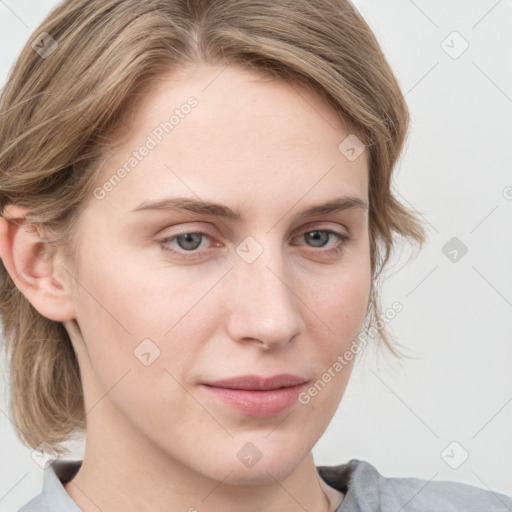 Joyful white young-adult female with medium  brown hair and blue eyes