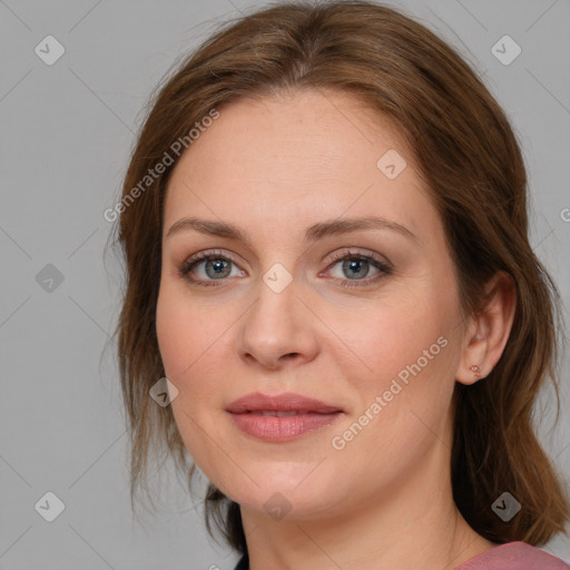 Joyful white young-adult female with medium  brown hair and blue eyes