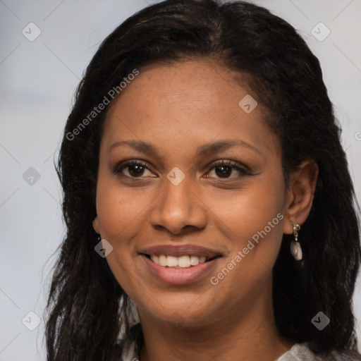 Joyful black young-adult female with long  brown hair and brown eyes