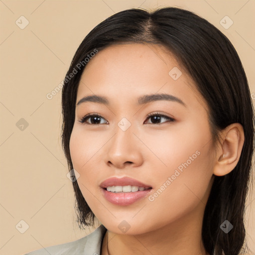 Joyful white young-adult female with long  black hair and brown eyes