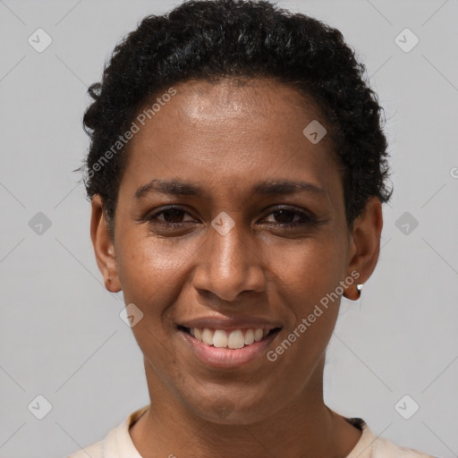 Joyful black young-adult female with short  brown hair and brown eyes