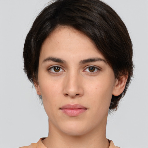 Neutral white young-adult female with medium  brown hair and brown eyes