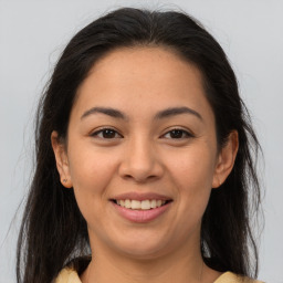 Joyful latino young-adult female with medium  brown hair and brown eyes