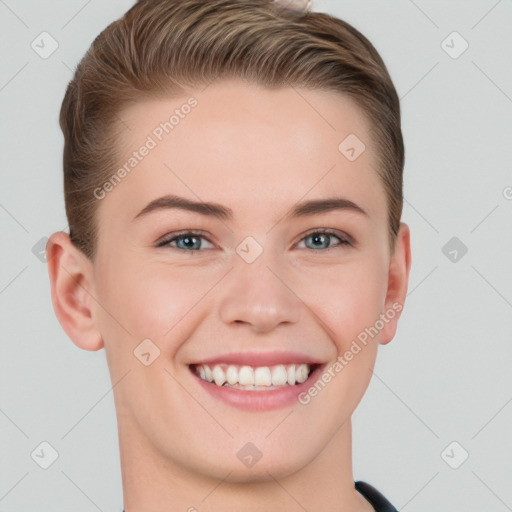 Joyful white young-adult female with short  brown hair and grey eyes