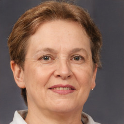 Joyful white middle-aged female with short  brown hair and brown eyes