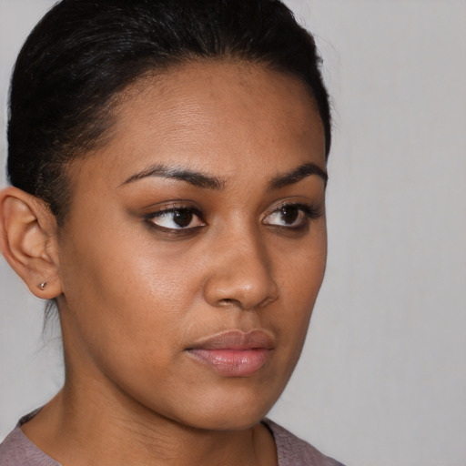 Neutral black young-adult female with short  brown hair and brown eyes