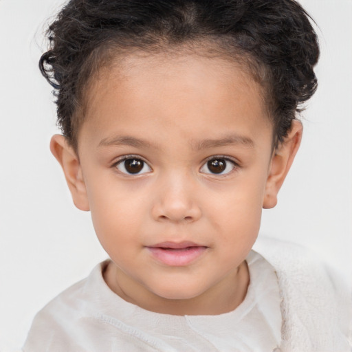 Joyful white child female with short  brown hair and brown eyes