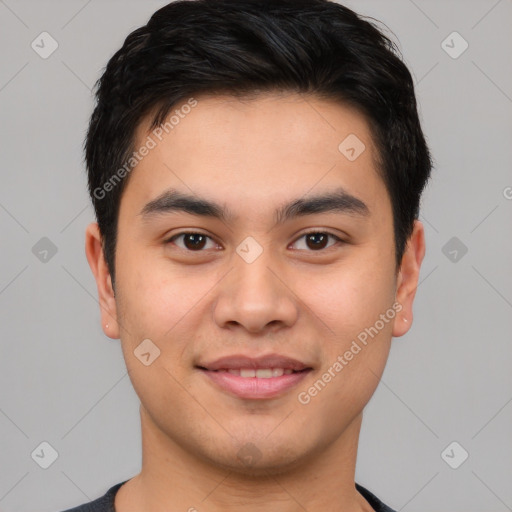 Joyful asian young-adult male with short  brown hair and brown eyes