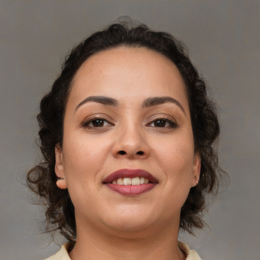 Joyful white young-adult female with medium  brown hair and brown eyes