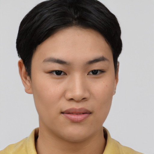 Joyful asian young-adult female with short  black hair and brown eyes