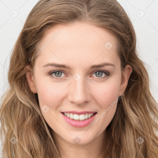 Joyful white young-adult female with long  brown hair and blue eyes