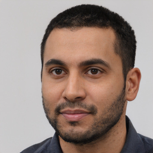 Neutral latino young-adult male with short  black hair and brown eyes