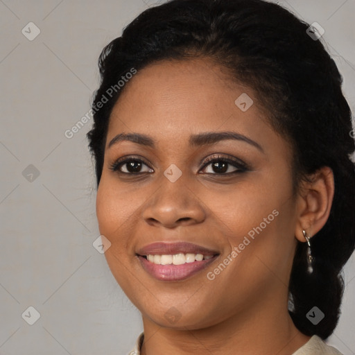 Joyful black young-adult female with medium  black hair and brown eyes