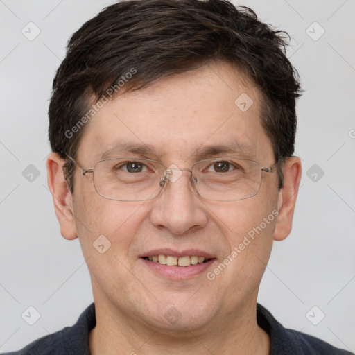 Joyful white adult male with short  brown hair and brown eyes