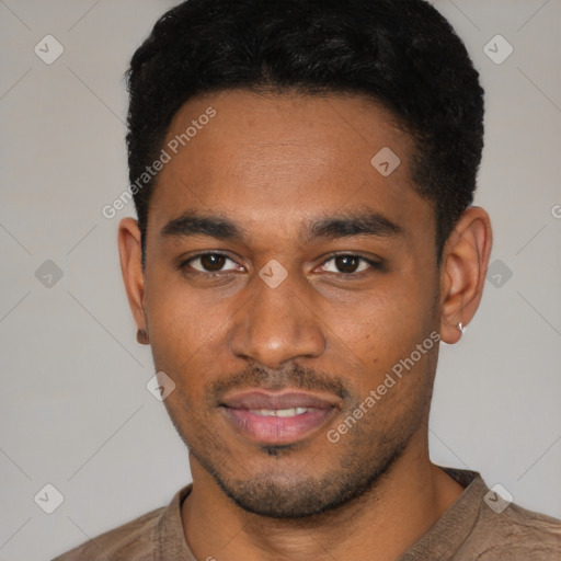Joyful black young-adult male with short  black hair and brown eyes
