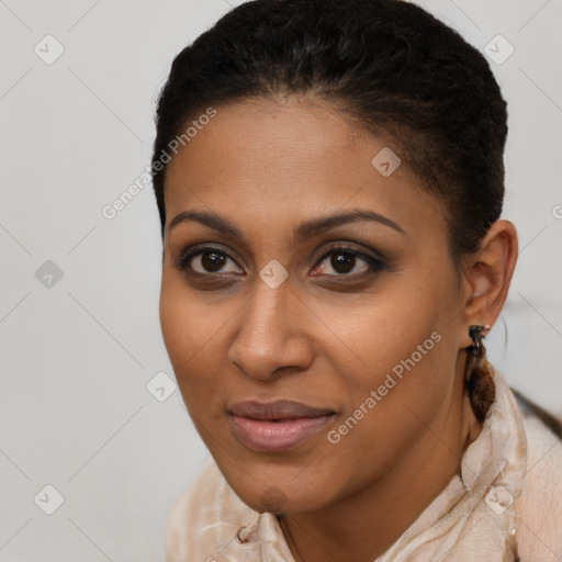 Joyful black young-adult female with short  brown hair and brown eyes