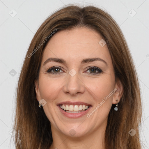 Joyful white adult female with long  brown hair and brown eyes