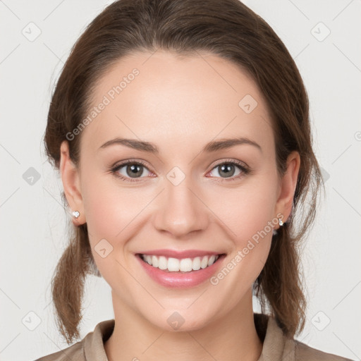 Joyful white young-adult female with medium  brown hair and grey eyes