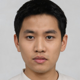 Neutral asian young-adult male with short  black hair and brown eyes