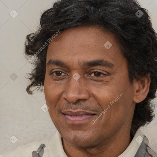 Joyful white adult male with medium  brown hair and brown eyes