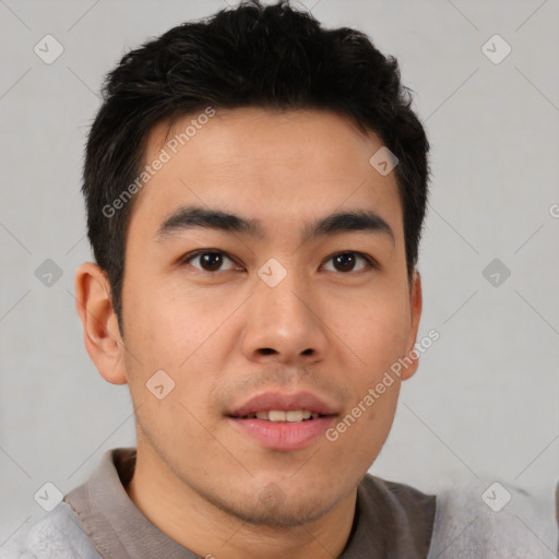 Joyful asian young-adult male with short  brown hair and brown eyes